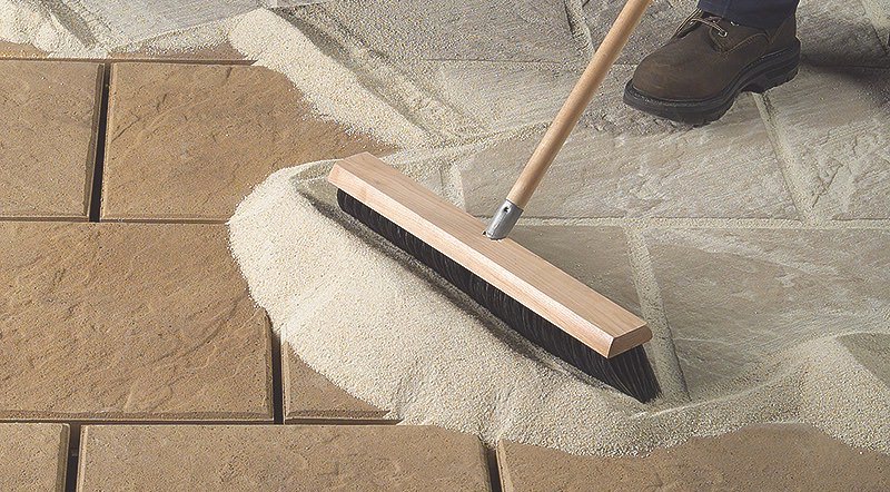 Sweeping poly sand over tile